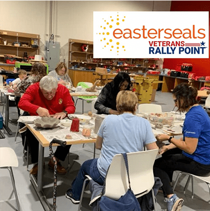 Elderly people and volunteers doing ceramics at a table and a graphic easterseals veterans rally point logo